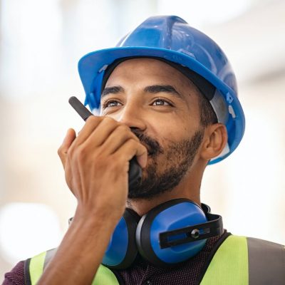 mixed-race-construction-worker-using-walkie-on-construction-site-1.jpg